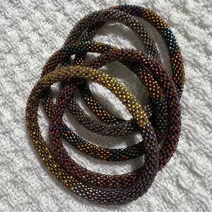 5 Sashka Co handcrafted beaded bracelets. Dark metallic colors. Approx 8”.